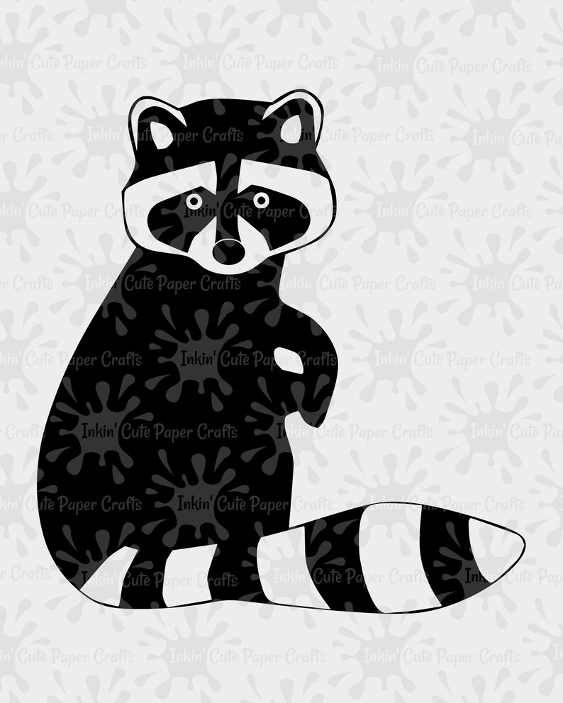 May include: Black and white silhouette of a raccoon with a striped tail. The raccoon is sitting up with its paws in front of it. The background is a light gray with a pattern of black ink splatters.