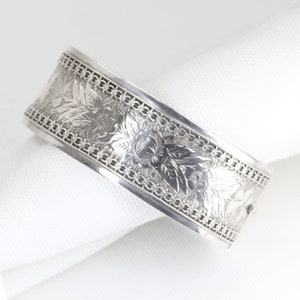 A Victorian Sterling Silver Wide Engraved Oval Hinged Bangle    -    Circa: 1890