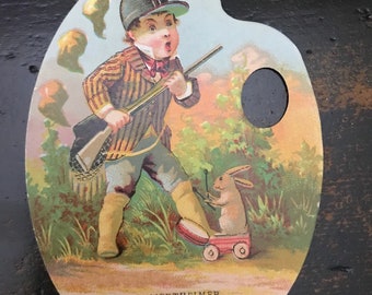 Early 1900's Trade Card Ephemera Boy hunting with toy rabbit playing a drum~ ephemera~ advertising Dry Goods & Notions~ S Wertheimer~ card