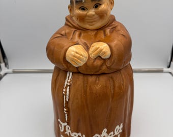 Tarro de cerámica vintage de 30 cm con diseño de fraile monje y la frase "No robarás". Bote de cocina con humor religioso.