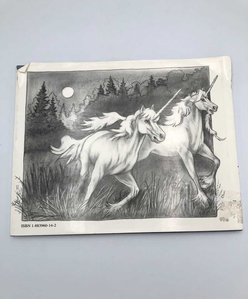 May include: A black and white pencil drawing of two unicorns running through a forest at night. The unicorns are white with silver horns and manes. The forest is dark and shadowy, with a full moon in the sky.
