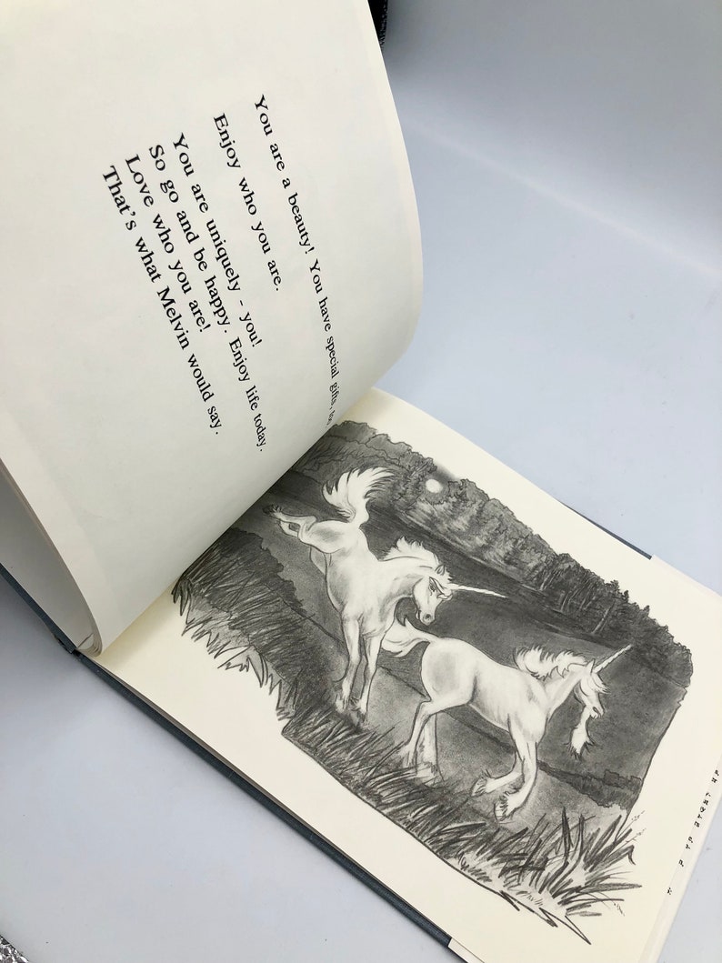 May include: A black and white illustration of two unicorns running through a field under a full moon. The text reads: "You are a beauty! You have special gifts. Enjoy who you are. You are uniquely - you! So go and be happy. Enjoy life today. Love who you are! That's what Melvin would say."