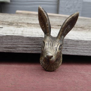 May include: A set of three ceramic mugs with a speckled, matte finish. The mugs are in shades of cream, light gray, and dark gray. Each mug has a simple, minimalist design, perfect for coffee or tea.