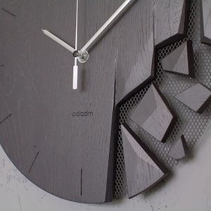 shattered wall clock by paladim studio