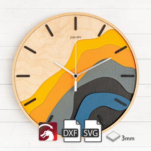 Op de afbeelding: Een houten wandklok met een kleurrijk abstract ontwerp met geel, oranje, blauw, grijs en zwart. De wijzerplaat van de klok is van hout en heeft zwarte wijzers en een eenvoudig zwart "paic dim" logo. De klok is 3 mm dik en beschikbaar in DXF en SVG formaten.