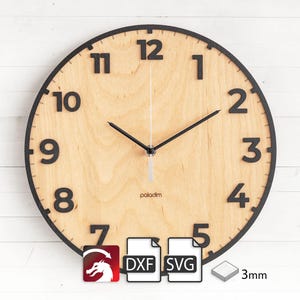 May include: A black and wood clock with black numbers and hands. The clock face is made of wood and has a black border. The clock is 3mm thick. The clock face has the word "paladin" printed on it. The clock is available in DXF and SVG formats.