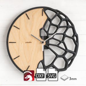 May include: Black and wood wall clock with a geometric design. The clock face is made of wood and has a simple design with black hour and minute hands. The clock is 3mm thick.