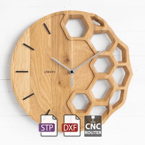 May include: Wooden wall clock with a honeycomb design. The clock has a natural wood finish, black hour markers, and silver hands. The word "paladim" is printed on the clock face. Includes STP, DXF, and CNC Router file icons.