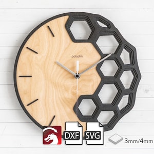 May include: A modern wall clock with a light wood grain face and black geometric honeycomb design. The clock features black hands and hour markers. The word "paladin" is printed on the clock face. Includes DXF and SVG file icons.