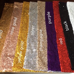 May include: A selection of sequin table runners in various colors, including gold, rose gold, yellow gold, silver, champagne, purple, red, black, and white.