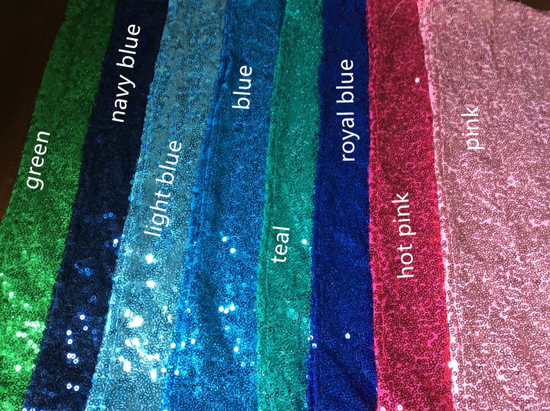 May include: A close-up of eight fabric swatches with sequins in different colors. The colors are green, navy blue, light blue, blue, teal, royal blue, hot pink, and pink.
