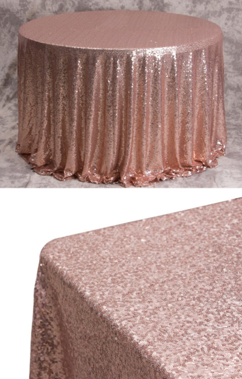 May include: A rose gold sequin tablecloth. The tablecloth is round and has a smooth, shiny surface.