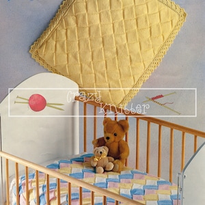 May include: A yellow knitted baby blanket with a crocheted border. The blanket is in a cot with two teddy bears. The blanket is 52-65 inches and 70-100 centimetres. The pattern is called "Pamper DK" by "Argyll".