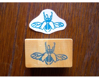 Rubber stamp little beetle flight