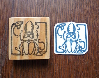 Hand carved stamp beetle