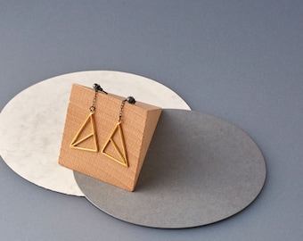 Gold-plated geometric triangle earrings on oxidised silver chains