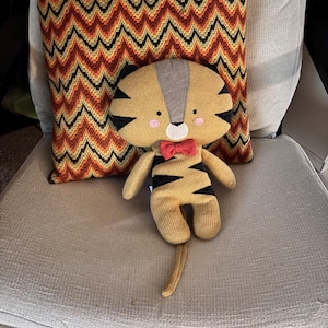 Crocheted Cartoon Big Head Odd Proportion Cat Plush. Stuffed Animal.  Anthropologie. 2017.