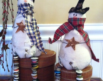 Primitive Sitting Snowman with Button Dangle Legs holding a Cinnamon Star