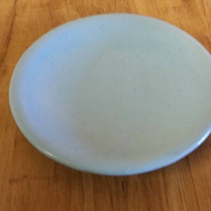 May include: A light blue oval-shaped ceramic plate.