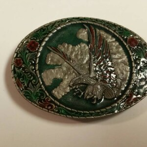 1982 Indiana Metal Craft Flying Eagle Froz-n Color Oval Belt Buckle with Red and Green Highlights