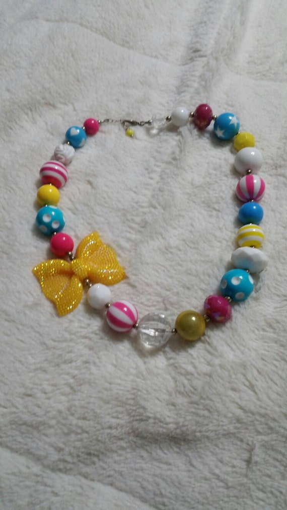 Bright Spring Colors with Yellow Glittery Bows Pla