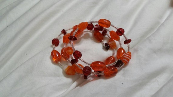 Orange and Red Plastic  Beaded Stretchable Memory… - image 1