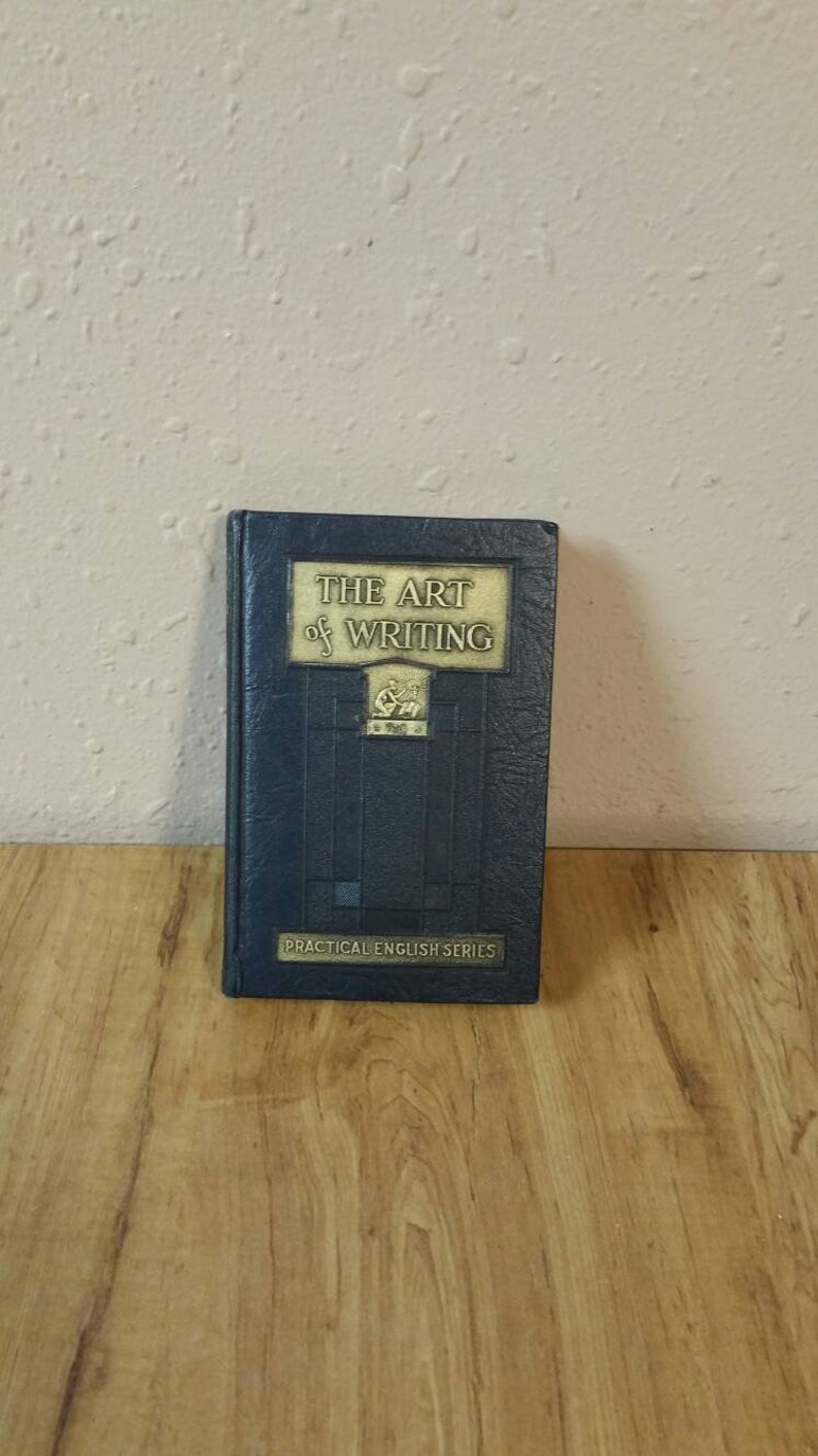 May include: A blue hardcover book titled "The Art of Writing" with gold lettering. The book is part of the "Practical English Series".
