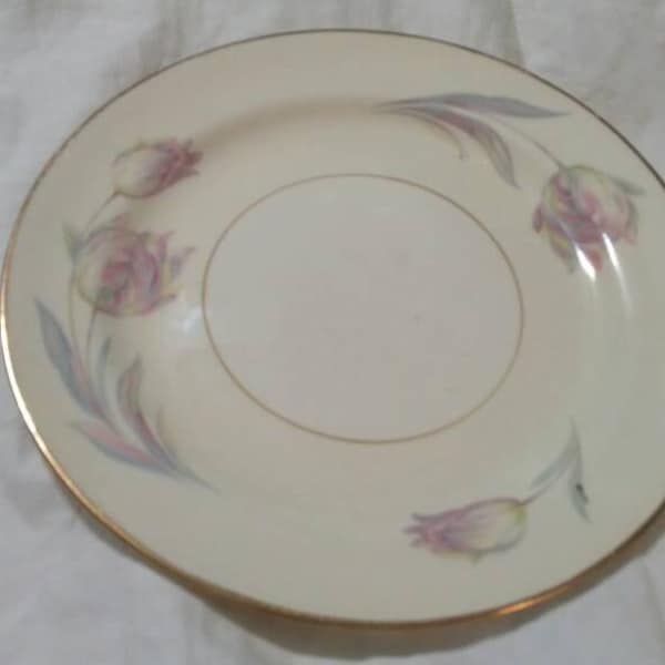 Pale Yellow Homer Laughlin Eggshell Nautilus 6.10 inch Bread/Butter Plate with Purple and Pink Tulip Design