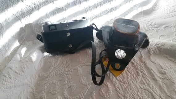 Bell and Howell/canon 45 Mm Camera With Original Leather Case