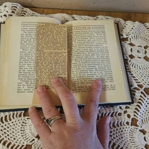 May include: A close-up of an open book with the title "Practical English in Business" on the cover. The book is open to a page with text about the importance of being polite and respectful in business.