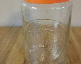 Tarro de café de cristal Anchor Hocking Old Mill con rueda hidráulica y tapa de plástico naranja