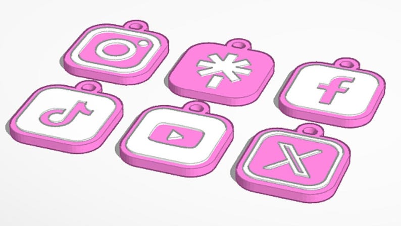May include: Six pink and white social media logo charms, including Instagram, TikTok, Facebook, YouTube, and X. Each charm has a loop for attaching to a keychain or necklace.