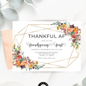 May include: White invitation card with gold geometric frame and floral accents. Text reads "THANKFUL AF friendsgiving feast" with event details. Includes a peach envelope and eucalyptus sprigs.