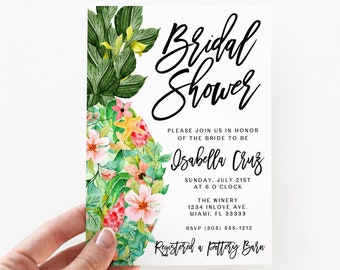 May include: A rectangular bridal shower invitation card featuring a watercolor pineapple illustration decorated with pink flowers and a yellow starfish. The text reads Bridal Shower, Isabella Cruz, Sunday, July 21st at 6 o'clock, The Winery, 1234 Inlove Ave, Miami, FL 33333, RSVP (305) 555-1212, Registered a Pottery Barn.