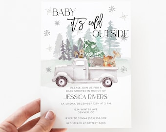 May include: Baby shower invitation with a watercolor illustration of a white truck carrying woodland animals. The text "Baby it's cold outside" is displayed above the truck. The invitation includes event details.