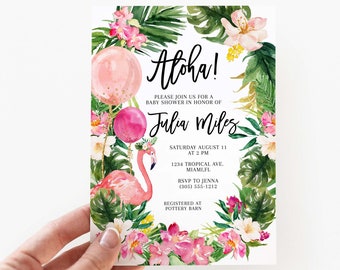 May include: A rectangular baby shower invitation card featuring a watercolor tropical theme with green palm leaves, pink hibiscus flowers, two pink balloons, and a pink flamingo. The text reads Aloha! Please join us for a baby shower in honor of Julia Miles, Saturday August 11 at 2 PM, 1234 Tropical Ave. Miami, FL, RSVP to Jenna (305) 555-1212, Registered at Pottery Barn.