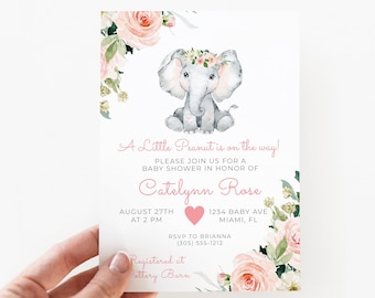 Puede incluir: Invitación a un baby shower con una ilustración en acuarela de un elefante gris con una corona de flores. La invitación incluye el texto "A Little Peanut is on the way!" y los detalles del baby shower de Catelynn Rose.