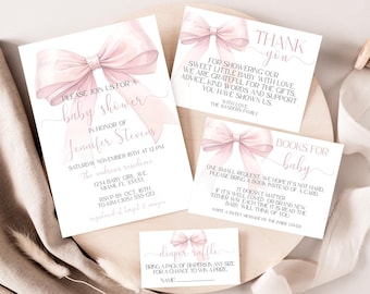 May include: A set of baby shower stationery featuring a large, soft pink watercolor bow design. The collection includes an invitation, a thank you card, a books for baby card, and a diaper raffle card, all printed with black text on white cardstock.