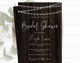 May include: Bridal shower invitation with a dark wood background and string lights. The invitation reads "Please join us for a Bridal Shower in honor of Kayla Lewis." Additional text includes the date, time, location, and RSVP information.