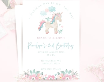 May include: White invitation card with a watercolor unicorn illustration. Text reads "A MAGICAL DAY IS ON THE WAY!" and "Penelope's 2nd Birthday". Floral border at the bottom. RSVP information included.