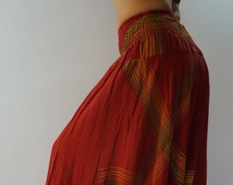 May include: Red, yellow, and green striped harem pants with a wide elastic waistband.