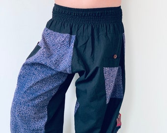 May include: Black and blue patterned pants with a drawstring waist and a patch pocket on the right leg.