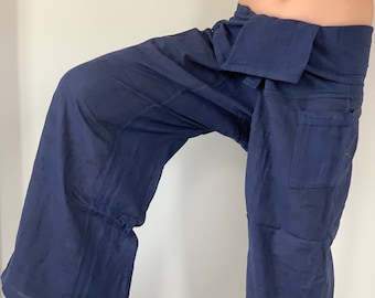 May include: A pair of navy blue Thai fisherman pants with a wide leg and a single pocket on the right side.