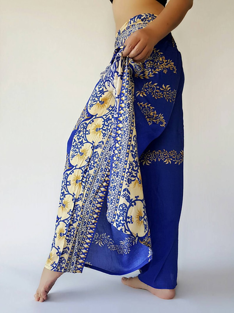 May include: Blue and cream patterned trousers with a wide leg and a tie at the waist.