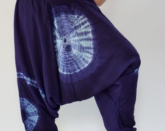 May include: Purple and blue tie-dye harem pants with a circular pattern.