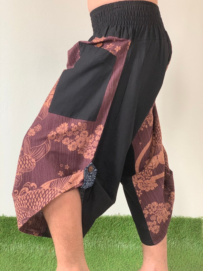 May include: Brown and black patterned pants with a black pocket and elastic waistband.