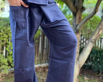 May include: A pair of dark blue, striped, cotton pants with a wide waistband that can be tied in the front. The pants have a pocket on the left side.