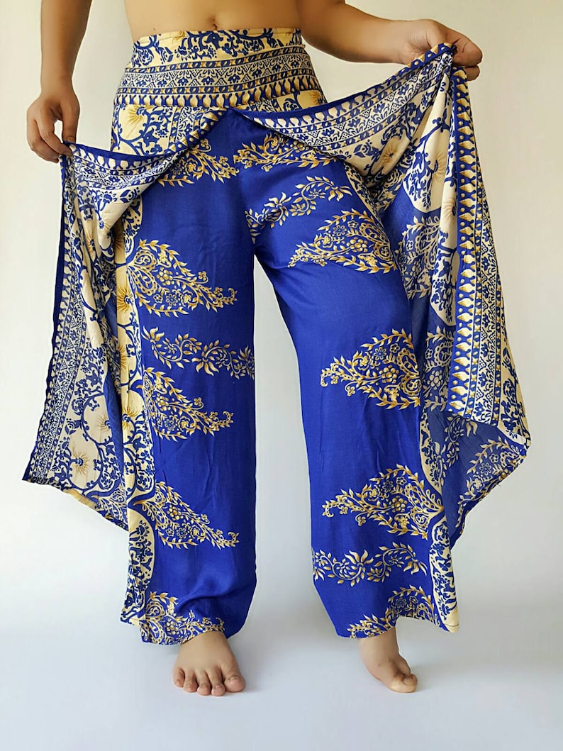 May include: Blue and gold patterned trousers with a wrap-around skirt. The skirt has a white and gold floral design.