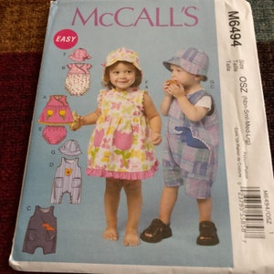 Uncut Factory Folded McCall&#39;s Pattern M6494 Sizes NB S M L Infants&#39; Dress Rompers Jumpsuit Panties & Hats Copyright 2012 27 Pattern Pieces