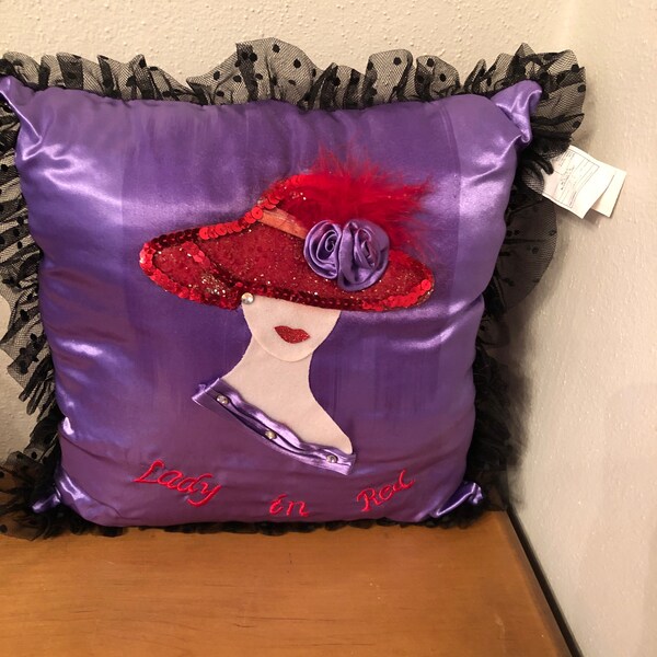 Lady In Red Pillow 12 Inch By 12 Inch Purple Pillow With Lady Wearing Red Hat With Sequins Feathers Purple Flowers & Red Lipstick Ear Ring